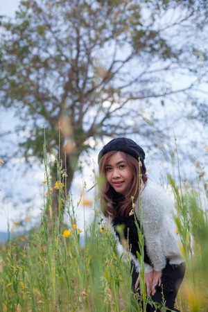 Beautiful asian woman in fields crotalaria,Thailand