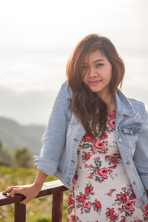 Asian beautiful girl smiling happy on warm sunshineの写真素材