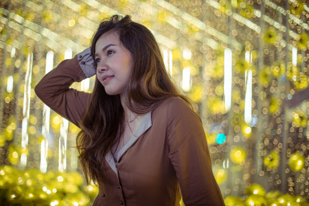 Portrait of asian woman, outdoor in night. Christmas and New Year conceptの写真素材