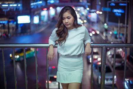 Portrait of lonely asian woman, outdoor in night. Christmas and New Year conceptの写真素材