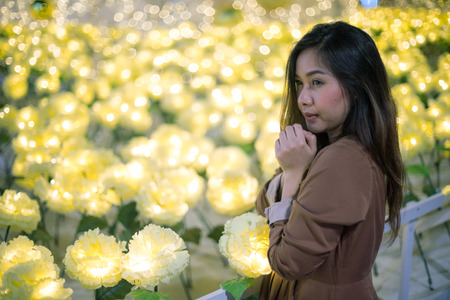 Portrait of lonely asian woman, outdoor in night. Christmas and New Year conceptの写真素材