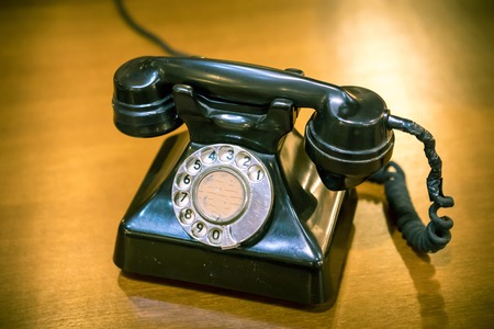 Vintage telephone on wood old table