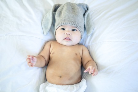Asian newborn baby in the bedroomの写真素材