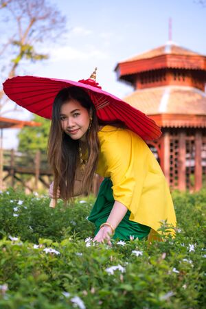 Thai woman dressing with  umbrella traditional styleの写真素材