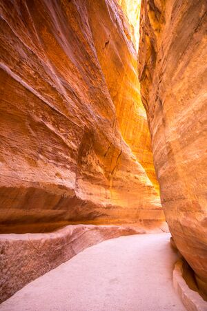 The Siq, the narrow slot-canyon entrance to the Petra,Jordanの写真素材