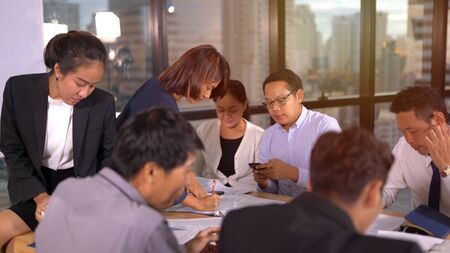 Businesspeople discussing together in conference roomの写真素材