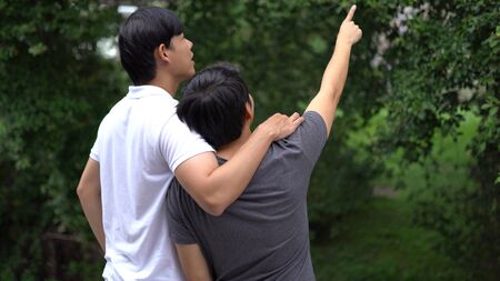 Young asian gay couple happy outdoorの写真素材