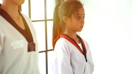 Teacher teaching taekwondo girl, Korean martial artの写真素材