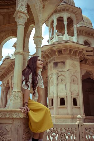 Asian Woman posing in Gaitore Ki Chhatriyan in Jaipur, India
