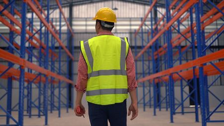 Warehouse worker working in a large warehouseの写真素材