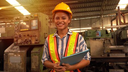 Portrait of an industrial woman engineer posing in a factory