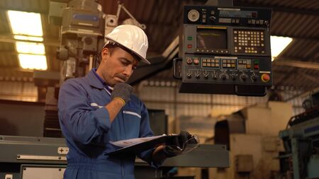 Service man engineer working at manufacturing factory