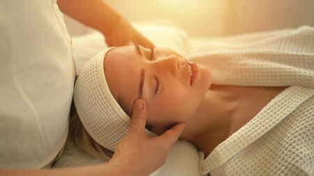 Young caucasian woman relax during massage on backの写真素材