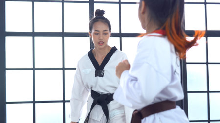 Teacher teaching taekwondo girl, Korean martial artの写真素材
