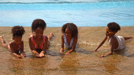 African kid having fun on vacation at a water park
