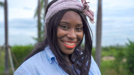 Happy African American woman outdoor at homeの写真素材