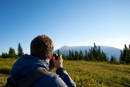 Photographer at work in the mountains