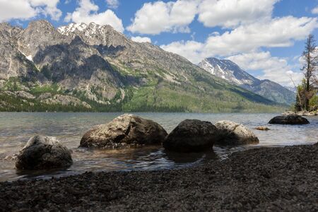 A fresh water lake in Montana with blue sky and clouds.の写真素材