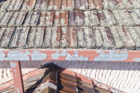 Terracotta Roof Tiles in poor condition on a house