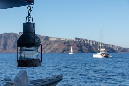 Yachts and sailing boats on the Aegean Sea in the Greek Islands near Santorini Islandの写真素材