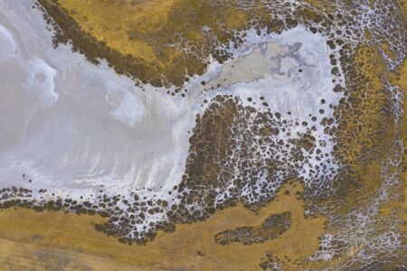 A large fresh water dam on Hindmarsh Island south of Adelaide in Australia that is dry due to drought and full of saltの写真素材