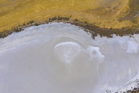 A large fresh water dam on Hindmarsh Island south of Adelaide in Australia that is dry due to...