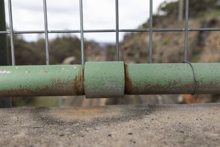 A rusty green steel pipe and threaded connection jointの写真素材