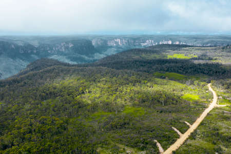 Aerial view of a dirt track running through the Grose Valley near Blackheath in The Blue Mountains...