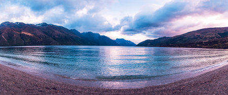 Photograph of mountain range surrounding a large lake on the South Island of New Zealandの写真素材