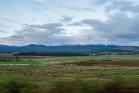 Photograph of snow on a large mountain range in Fiordland National Park on the South Island of New Zealandの写真素材