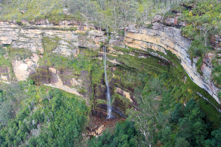 Photograph of a scenic waterfall cascading in the Grose Valley near Blackheath in the Blue Mountains in New South Wales, Australia.の写真素材