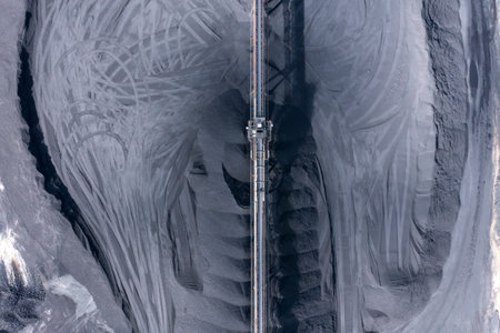 Drone aerial photograph of industrial machinery processing and moving crushed coal in a Colliery in regional Australia.の写真素材