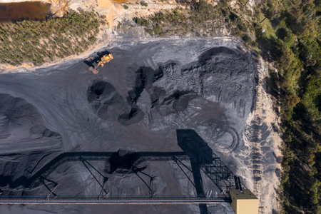 Drone aerial photograph of industrial machinery processing and moving crushed coal in a Colliery in regional Australia.の写真素材
