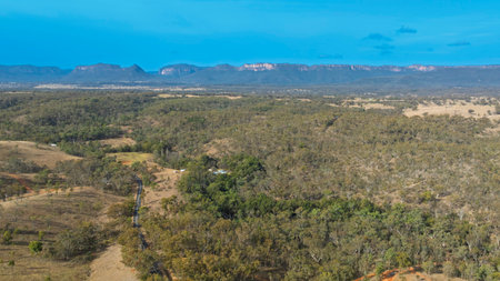 Drone aerial photograph of a road running through the picturesque Capertee Valley in Wollemi National Park in the Central Tablelands of NSW, Australia.の写真素材