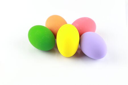 Colorful easter eggs isolated on a white, focus on yellow eggの写真素材