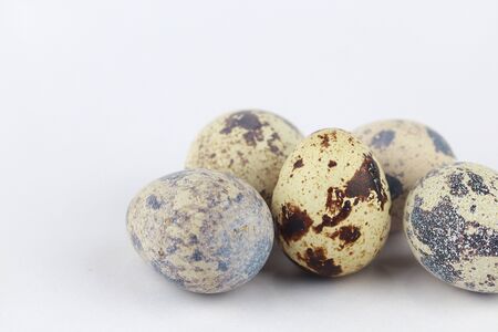 Quail eggs isolated on a white, selective focusの写真素材