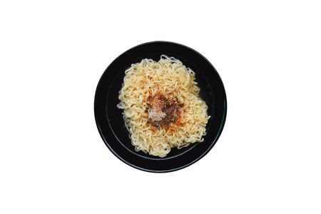 Top view of Instant noodles with seasoning in black bowlの写真素材