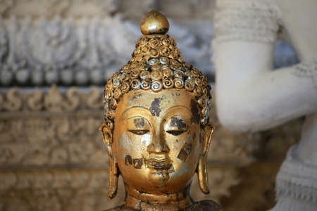 Close up face of buddha sculpture in Wat San Pa Yang Luang temple, lamphun city in North of Thailandの写真素材