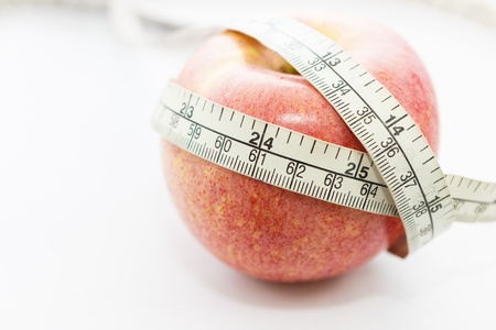 An apple for diet concept on white backgroundの写真素材