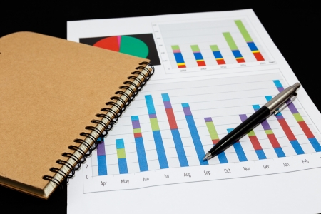 Business report  graph with pen and notebook の写真素材
