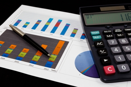 Business report  graph with pen and calculator の写真素材