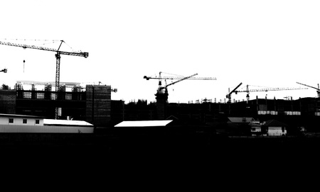 silhouette crane building in construction siteの写真素材