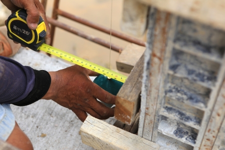 labor man using a plumb bob for check 	pillarの写真素材