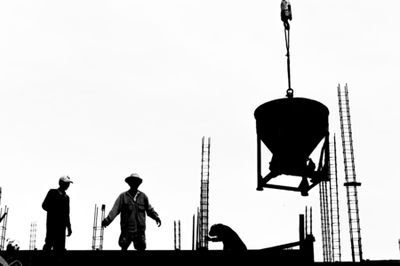 silhouette labor cement working in construction site の写真素材