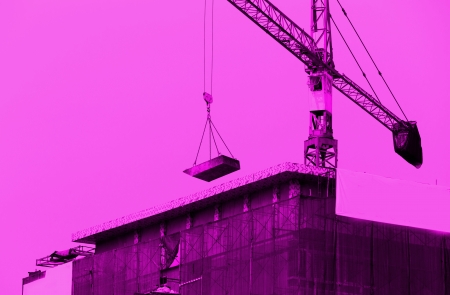 Crane working in construction site の写真素材