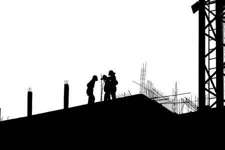 silhouette labor working in construction site の写真素材