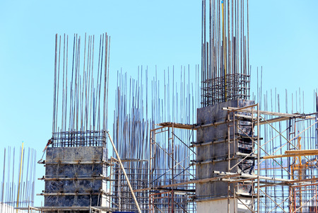 building cement pillar in construction site with blue sky