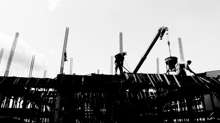 silhouette labor working in construction site の写真素材
