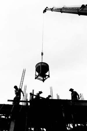 silhouette labor working in construction site の写真素材