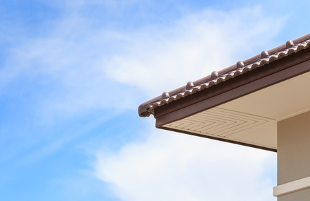 roof under construction with stacks of roof tiles for home building 